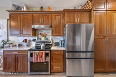 This beautifully updated 3-bedroom, 2-bathroom residence on Quail Wood Greens Golf Course in Arizona - for sale on GolfHomes.com, golf home, golf lot