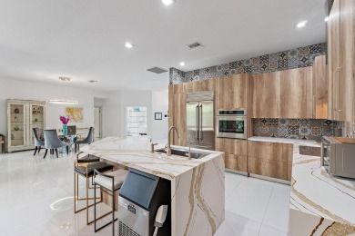 Welcome to this beautiful modern waterfront home with private on The Bears Club in Florida - for sale on GolfHomes.com, golf home, golf lot