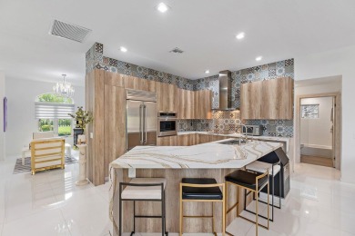 Welcome to this beautiful modern waterfront home with private on The Bears Club in Florida - for sale on GolfHomes.com, golf home, golf lot