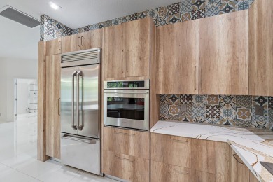 Welcome to this beautiful modern waterfront home with private on The Bears Club in Florida - for sale on GolfHomes.com, golf home, golf lot
