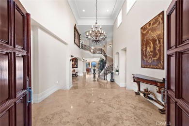 Indulge in elegant coastal living at this opulent ocean-view on Pelican Hill Golf Club in California - for sale on GolfHomes.com, golf home, golf lot