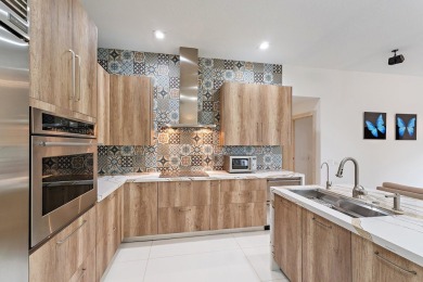 Welcome to this beautiful modern waterfront home with private on The Bears Club in Florida - for sale on GolfHomes.com, golf home, golf lot