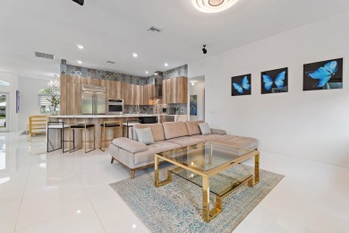 Welcome to this beautiful modern waterfront home with private on The Bears Club in Florida - for sale on GolfHomes.com, golf home, golf lot