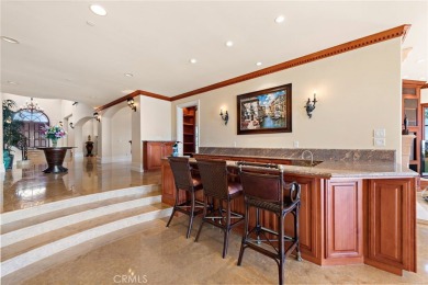 Indulge in elegant coastal living at this opulent ocean-view on Pelican Hill Golf Club in California - for sale on GolfHomes.com, golf home, golf lot