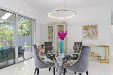 Welcome to this beautiful modern waterfront home with private on The Bears Club in Florida - for sale on GolfHomes.com, golf home, golf lot