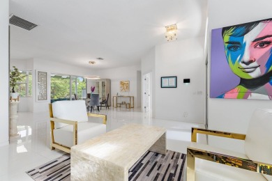 Welcome to this beautiful modern waterfront home with private on The Bears Club in Florida - for sale on GolfHomes.com, golf home, golf lot