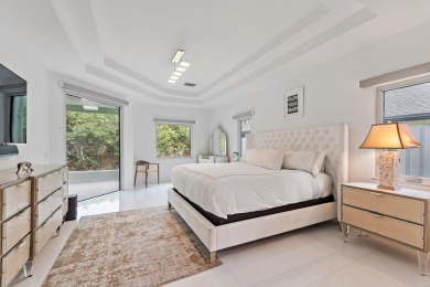 Welcome to this beautiful modern waterfront home with private on The Bears Club in Florida - for sale on GolfHomes.com, golf home, golf lot