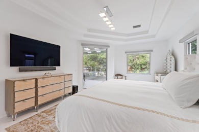 Welcome to this beautiful modern waterfront home with private on The Bears Club in Florida - for sale on GolfHomes.com, golf home, golf lot