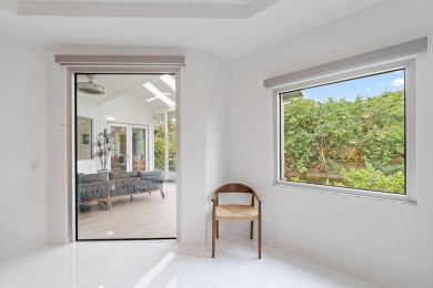 Welcome to this beautiful modern waterfront home with private on The Bears Club in Florida - for sale on GolfHomes.com, golf home, golf lot