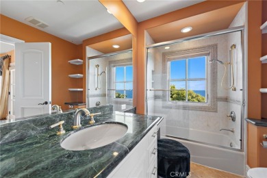 Indulge in elegant coastal living at this opulent ocean-view on Pelican Hill Golf Club in California - for sale on GolfHomes.com, golf home, golf lot