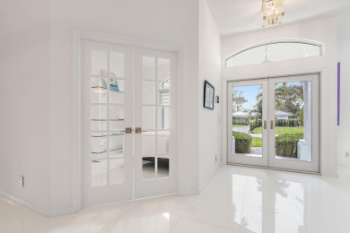 Welcome to this beautiful modern waterfront home with private on The Bears Club in Florida - for sale on GolfHomes.com, golf home, golf lot