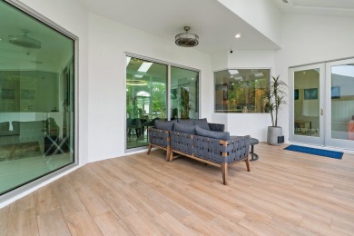 Welcome to this beautiful modern waterfront home with private on The Bears Club in Florida - for sale on GolfHomes.com, golf home, golf lot