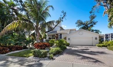 Surrounded by tropical landscaping, this 3BR/3 1/2 BA residence on Longboat Key Golf Club Resort in Florida - for sale on GolfHomes.com, golf home, golf lot