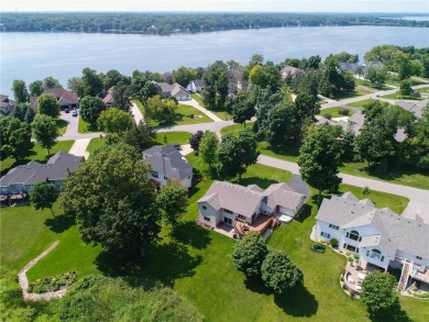 Discover luxurious living in this stunning 5-bedroom, 4-bathroom on Geneva Golf Club in Minnesota - for sale on GolfHomes.com, golf home, golf lot