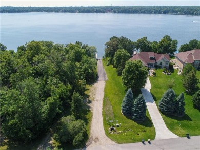 Discover luxurious living in this stunning 5-bedroom, 4-bathroom on Geneva Golf Club in Minnesota - for sale on GolfHomes.com, golf home, golf lot