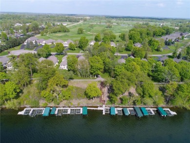 Discover luxurious living in this stunning 5-bedroom, 4-bathroom on Geneva Golf Club in Minnesota - for sale on GolfHomes.com, golf home, golf lot