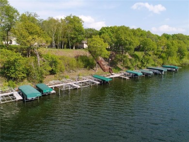 Discover luxurious living in this stunning 5-bedroom, 4-bathroom on Geneva Golf Club in Minnesota - for sale on GolfHomes.com, golf home, golf lot