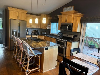 Discover luxurious living in this stunning 5-bedroom, 4-bathroom on Geneva Golf Club in Minnesota - for sale on GolfHomes.com, golf home, golf lot