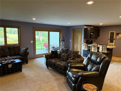 Discover luxurious living in this stunning 5-bedroom, 4-bathroom on Geneva Golf Club in Minnesota - for sale on GolfHomes.com, golf home, golf lot