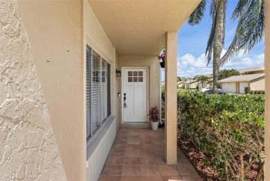 Nestled within the serene waterfront Mariners Pass community on Mangrove Bay Golf Course in Florida - for sale on GolfHomes.com, golf home, golf lot