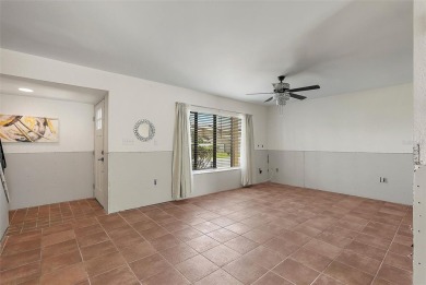 Nestled within the serene waterfront Mariners Pass community on Mangrove Bay Golf Course in Florida - for sale on GolfHomes.com, golf home, golf lot