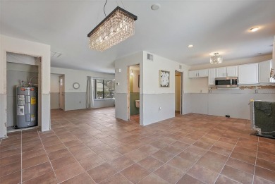 Nestled within the serene waterfront Mariners Pass community on Mangrove Bay Golf Course in Florida - for sale on GolfHomes.com, golf home, golf lot