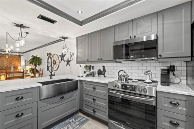 STUNNING!  This renovated condo is simply stunning!  Located in on East Lake Woodlands Country Club in Florida - for sale on GolfHomes.com, golf home, golf lot