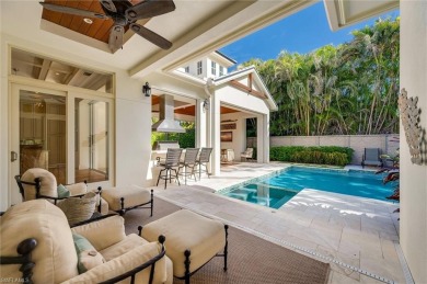 In the heart of the Moorings sits a picture-perfect single story on The Moorings Country Club in Florida - for sale on GolfHomes.com, golf home, golf lot