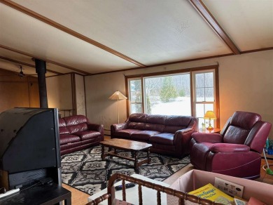 Located on a peaceful golf course and just moments from 500 ft on Antrim Dells Golf Course in Michigan - for sale on GolfHomes.com, golf home, golf lot