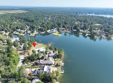 Gorgeous waterfront lot in highly desirable 7LW community. Lot on Beacon Ridge Golf and Country Club in North Carolina - for sale on GolfHomes.com, golf home, golf lot