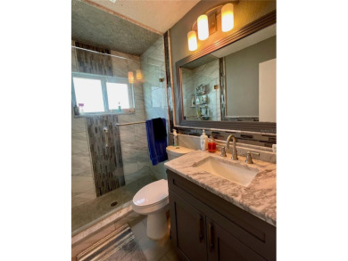 This home has  2-bedrooms, 2-bathrooms, 1,129 square feet and a on Mainlands Golf Club in Florida - for sale on GolfHomes.com, golf home, golf lot