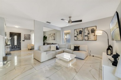 A welcoming blend of style, expertly designed space, and peace on Stoneybrook East Golf Club in Florida - for sale on GolfHomes.com, golf home, golf lot