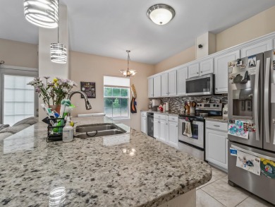 Welcome to this beautifully maintained 3-bedroom, 2-bathroom on Wildwood Country Club in Florida - for sale on GolfHomes.com, golf home, golf lot