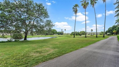 Beautifully redesigned 2-bedroom, 2-bathroom first-floor unit on Wynmoor Golf Course in Florida - for sale on GolfHomes.com, golf home, golf lot