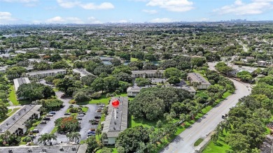 Beautifully redesigned 2-bedroom, 2-bathroom first-floor unit on Wynmoor Golf Course in Florida - for sale on GolfHomes.com, golf home, golf lot