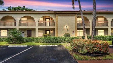 Beautifully redesigned 2-bedroom, 2-bathroom first-floor unit on Wynmoor Golf Course in Florida - for sale on GolfHomes.com, golf home, golf lot