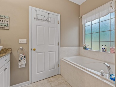 Welcome to this beautifully maintained 3-bedroom, 2-bathroom on Wildwood Country Club in Florida - for sale on GolfHomes.com, golf home, golf lot