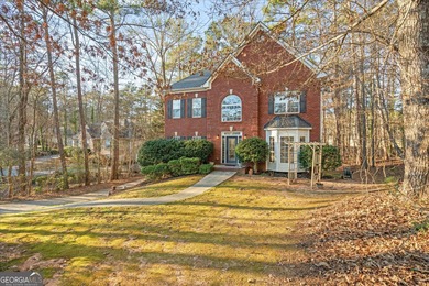 This spacious four-bedroom residence sits on an impressive on Fairfield Plantation Golf and Country Club in Georgia - for sale on GolfHomes.com, golf home, golf lot