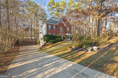 This spacious four-bedroom residence sits on an impressive on Fairfield Plantation Golf and Country Club in Georgia - for sale on GolfHomes.com, golf home, golf lot