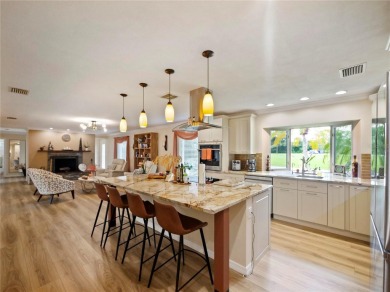 This amazing, meticulously remodeled one-story pool home offers on Rolling Hills Golf Club in Florida - for sale on GolfHomes.com, golf home, golf lot