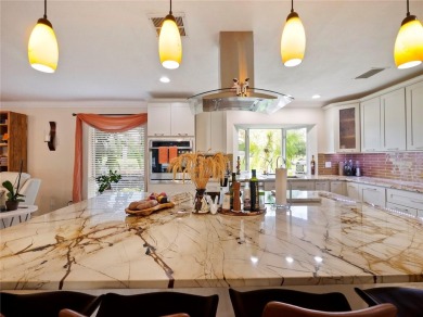 This amazing, meticulously remodeled one-story pool home offers on Rolling Hills Golf Club in Florida - for sale on GolfHomes.com, golf home, golf lot