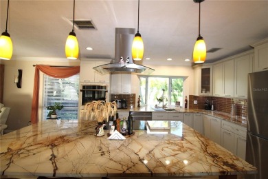 This amazing, meticulously remodeled one-story pool home offers on Rolling Hills Golf Club in Florida - for sale on GolfHomes.com, golf home, golf lot