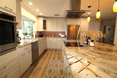 This amazing, meticulously remodeled one-story pool home offers on Rolling Hills Golf Club in Florida - for sale on GolfHomes.com, golf home, golf lot