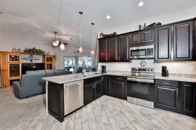 Wake up every day feeling like you're on vacation in this on Tampa Bay Golf and Country Club in Florida - for sale on GolfHomes.com, golf home, golf lot