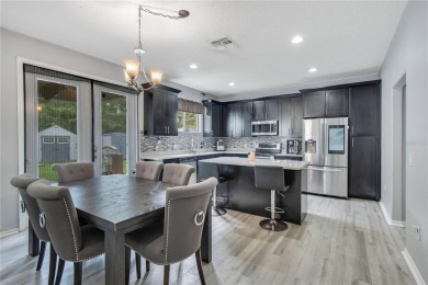 This beautifully updated 5-bedroom, 3-bath home is located in a on Wedgefield Golf Club in Florida - for sale on GolfHomes.com, golf home, golf lot