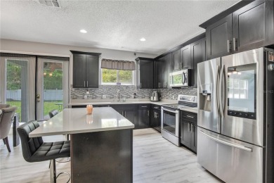 This beautifully updated 5-bedroom, 3-bath home is located in a on Wedgefield Golf Club in Florida - for sale on GolfHomes.com, golf home, golf lot