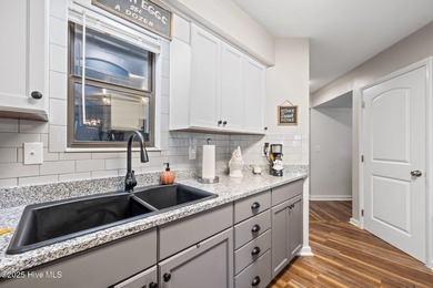 Fresh, bright, and move-in ready--this ground-floor 2BR/2BA on Olde Point Golf and Country Club in North Carolina - for sale on GolfHomes.com, golf home, golf lot