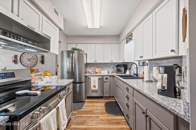 Fresh, bright, and move-in ready--this ground-floor 2BR/2BA on Olde Point Golf and Country Club in North Carolina - for sale on GolfHomes.com, golf home, golf lot