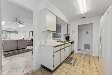 Warm and Inviting 2 bedroom 2 bath patio-style condo in a on The Club At Pelican Bay - South Course in Florida - for sale on GolfHomes.com, golf home, golf lot