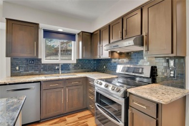 SITTING ON THE GOLF COURSE with both **mountain and city views** on Red Rocks Country Club in Colorado - for sale on GolfHomes.com, golf home, golf lot